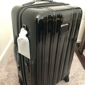 Brand new black tumi international carry on V3
